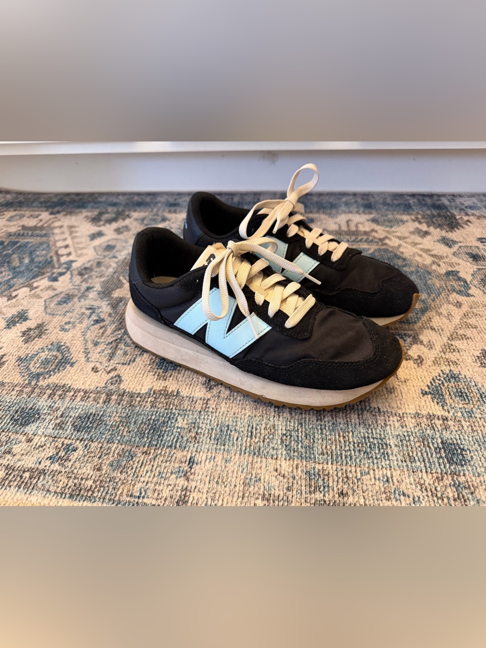 New Balance Women's Black Sneakers with Light Blue 'N'